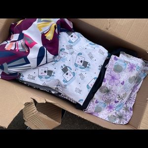 Box of almost like new scrubs for women. Size small-medium.